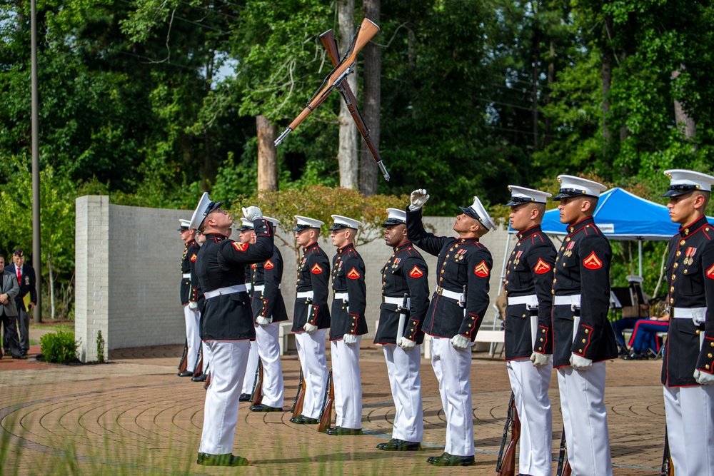 Marines with Silent Drill Platoon march during a performance at the 12th Montford Point Marine Day Ceremony