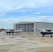 Thee Air Force Auxiliary airplanes stand ready to fly photography sorties as the weather clears