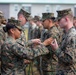 Marines with 3rd Battalion, 6th Marine Regiment receive a French Fourragere