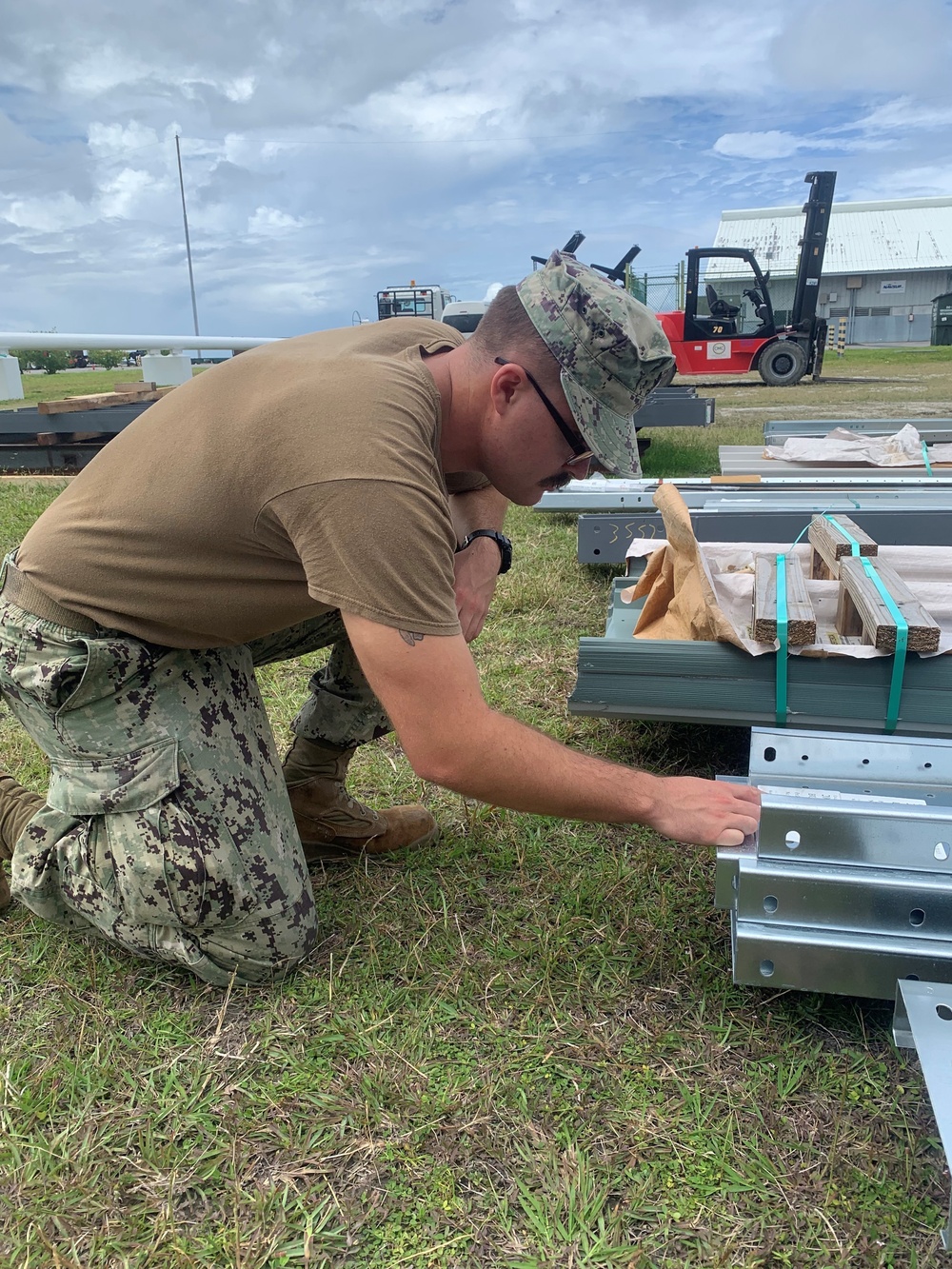 US Navy Seabees assigned to NMCB-5 prepare to build a gas cylinder storage unit