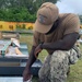 US Navy Seabees assigned to NMCB-5 prepare to build a gas cylinder storage unit