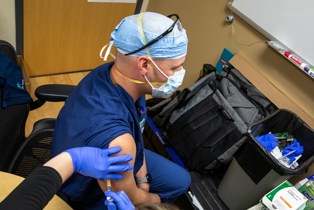 Member of the U.S. Army Medical Response Team Does Routine Hospital Work