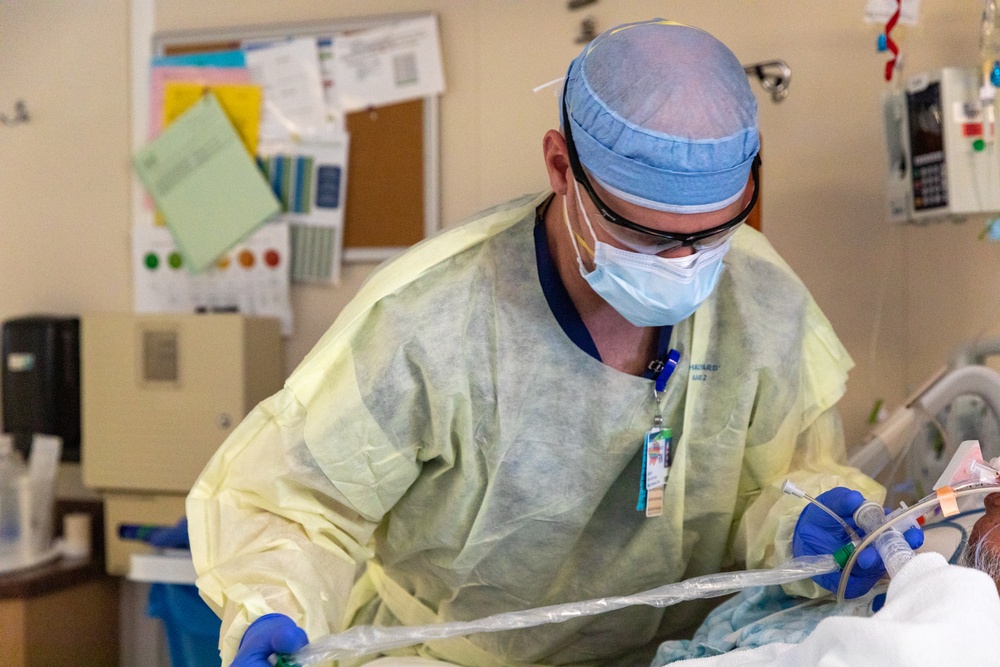 Member of the U.S. Army Medical Response Team Does Routine Hospital Work