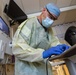 Member of the U.S. Army Medical Response Team Does Routine Hospital Work