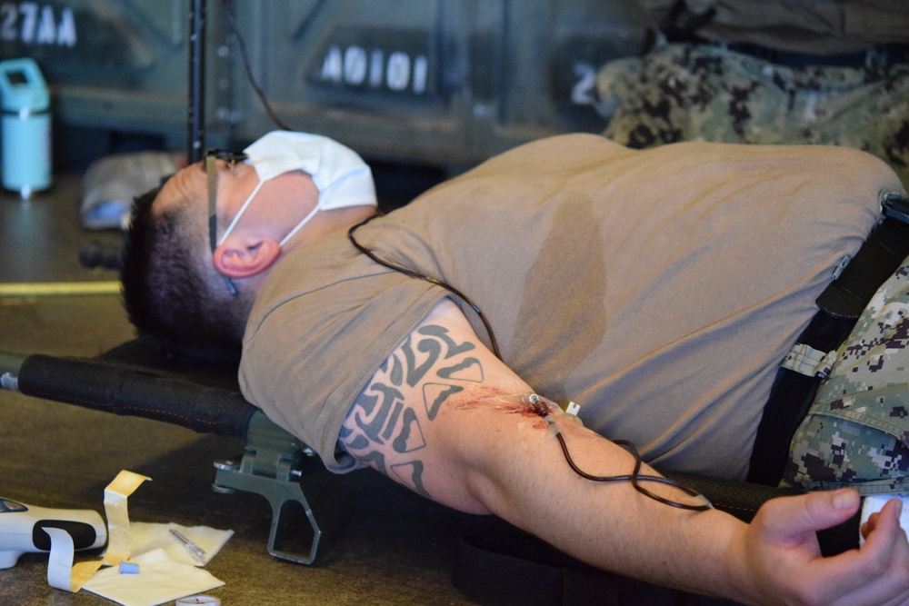US Navy Corpsman assigned to Naval Mobile Construction Battalion 5 train at Project Valkyrie