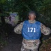 Soldier of the year competitor runs through tunnel of trees