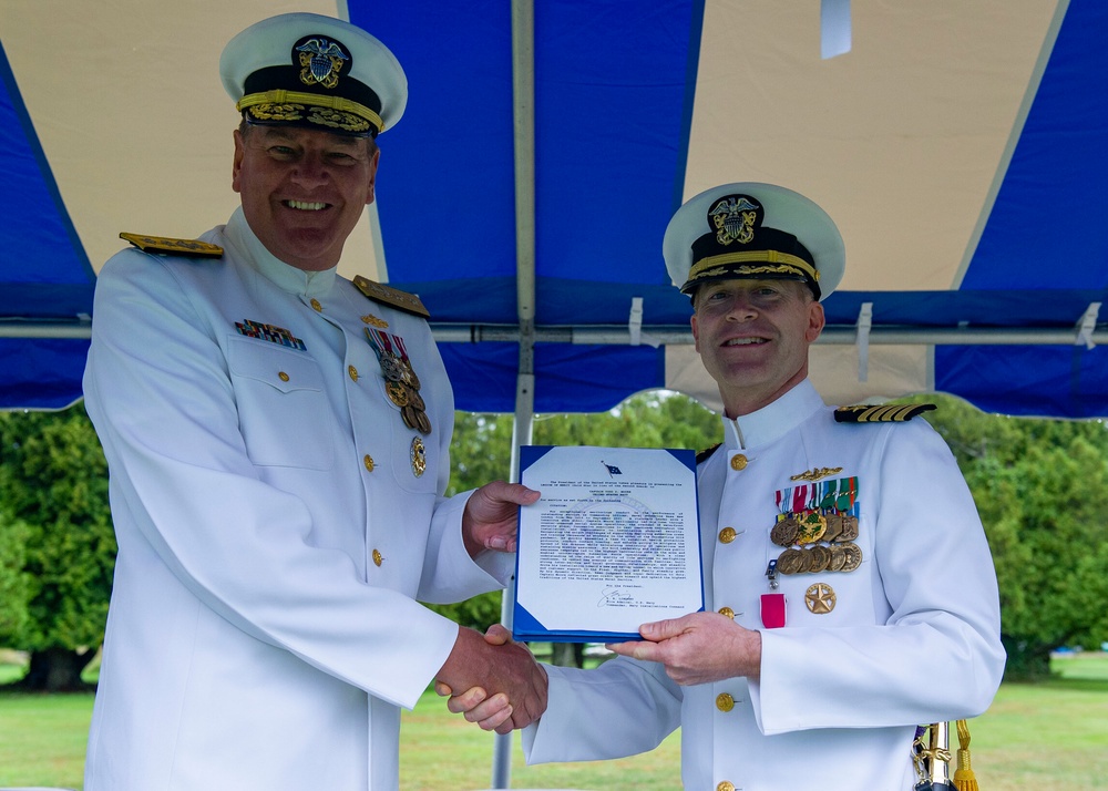 Naval Submarine Base (SUBASE) New London held its 52nd change of command as Capt. Todd Moore relinquished command to Capt. Kenneth Curtin Jr. , Sep. 24, during an outdoor ceremony near the base’s North Lake Pavilion