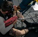 USS Sioux City Sailors Secures Himself in a Rescue Strop During a Shipboard SAR Exercise