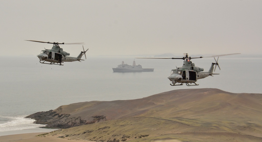 Two UH-1Y Venoms attached to Marine Light Attack Helicopter Squadron (MLA) 269 disembark the amphibious transport dock ship USS John P. Murtha (LPD 26)