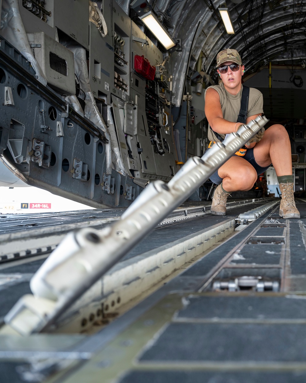 U.S. Airman Helps Flip Rollers