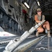 U.S. Airman Helps Flip Rollers