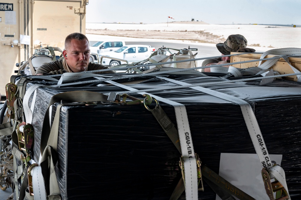 U.S. Airmen Load Cargo