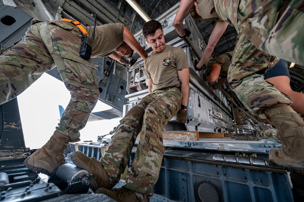 U.S. Airmen Load Cargo