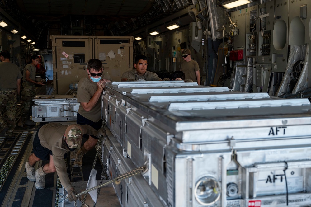 U.S. Air Force Airmen Unload Cargo