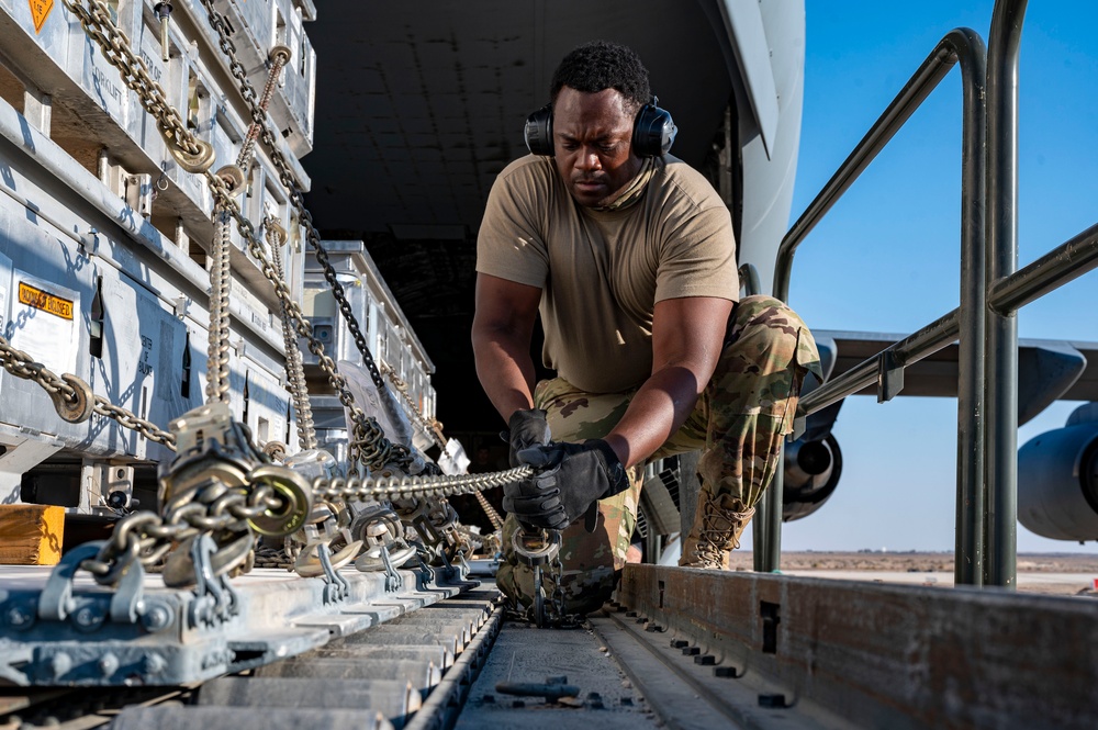 U.S. Air Force Airman Secures Cargo To K-Loader