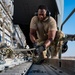 U.S. Air Force Airman Secures Cargo To K-Loader