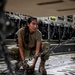 U.S. Air Force Airman Secures Vehicle To Aircraft