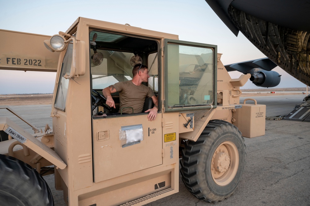 U.S. Air Force Airman Steers Forklift Onto Aircraft