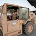 U.S. Air Force Airman Steers Forklift Onto Aircraft