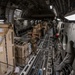 U.S. Air Force Loadmaster Ensures Cargo Is Secured Properly