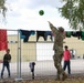 2nd Calvary Regiment plays catch with Afghan child during Operation Allies Welcome