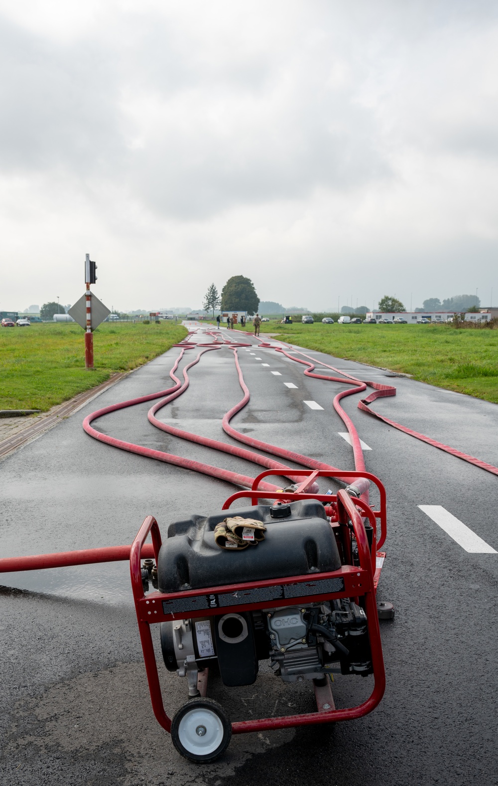 Firefighters check a kilometer of firehoses