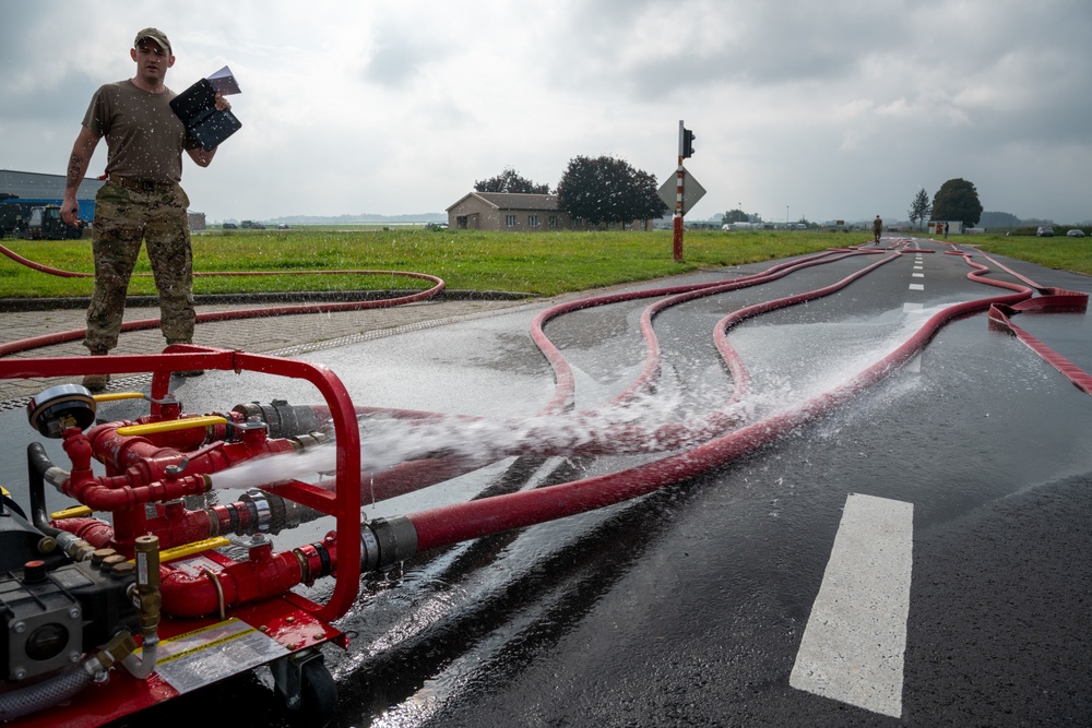 Firefighters check a kilometer of firehoses