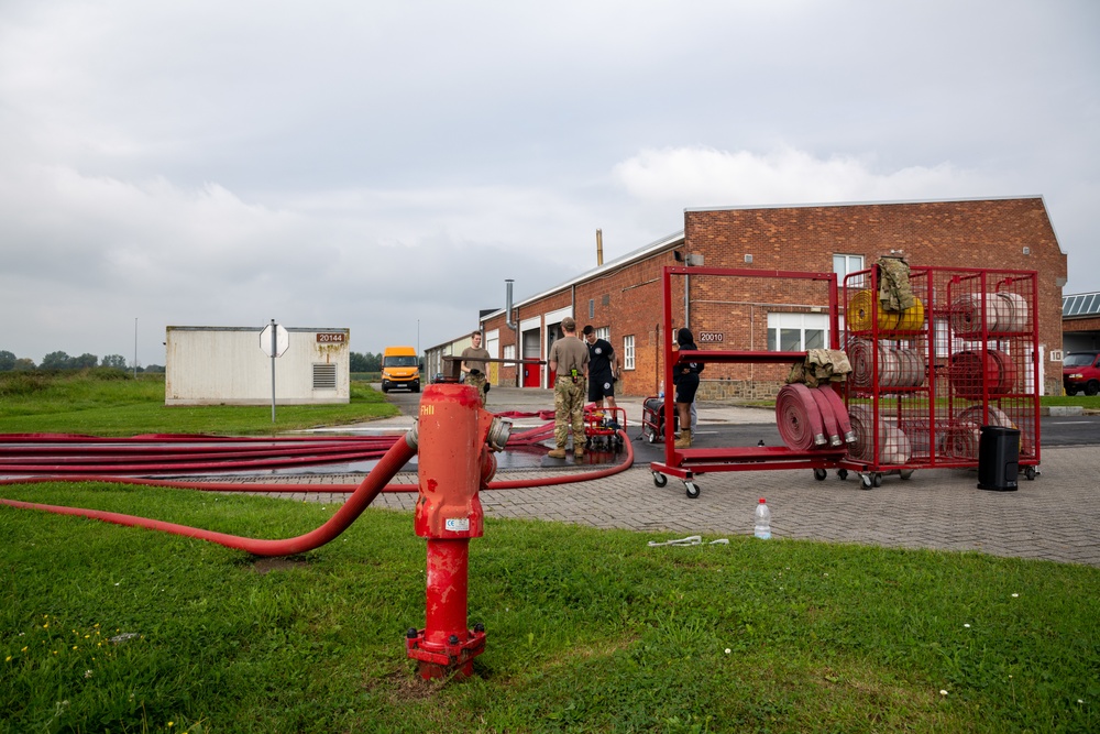 Firefighters check a kilometer of firehoses