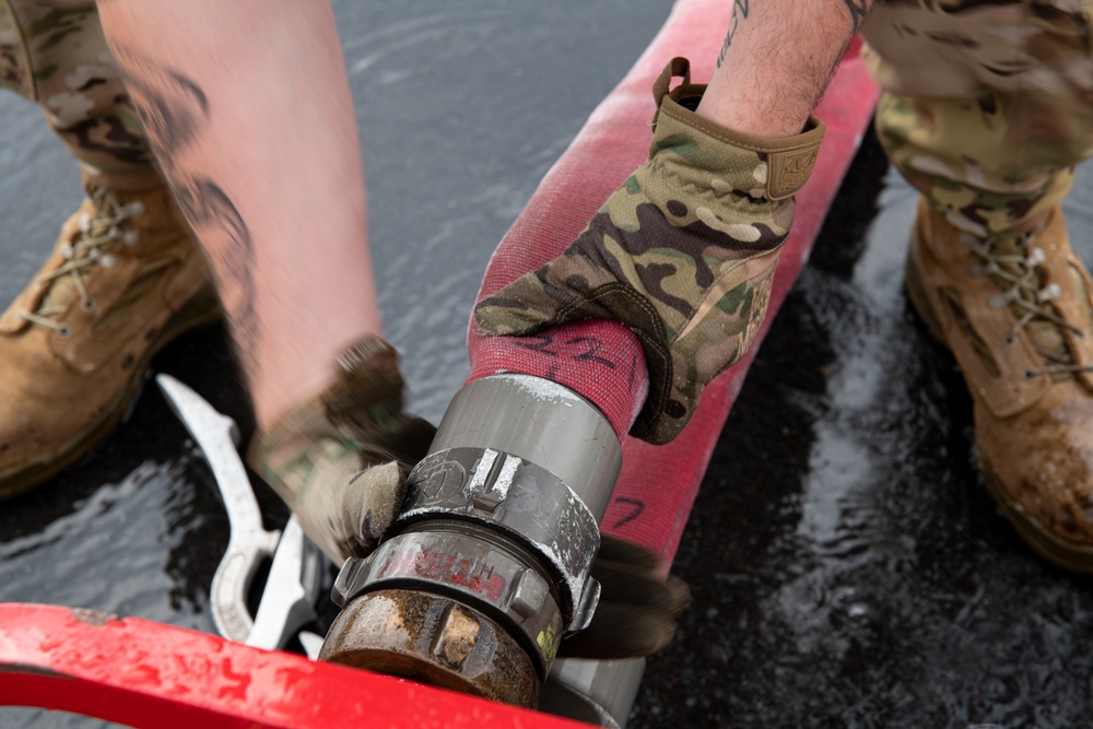 Firefighters check a kilometer of firehoses