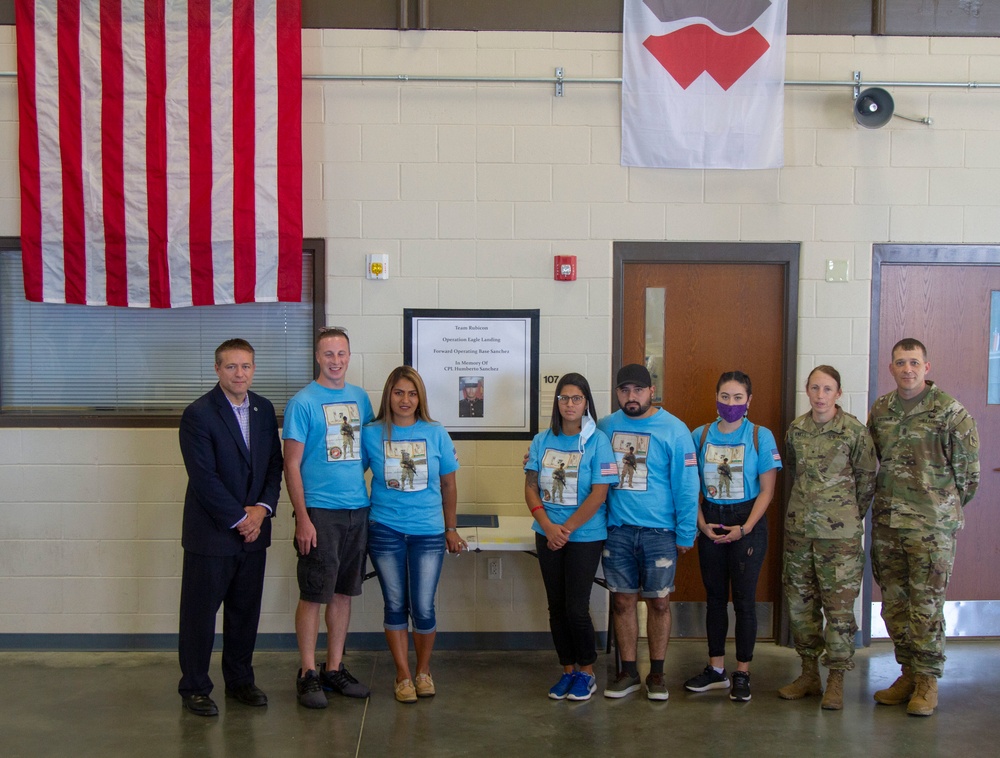 Personnel stationed at Camp Atterbury welcome the family of fallen service member