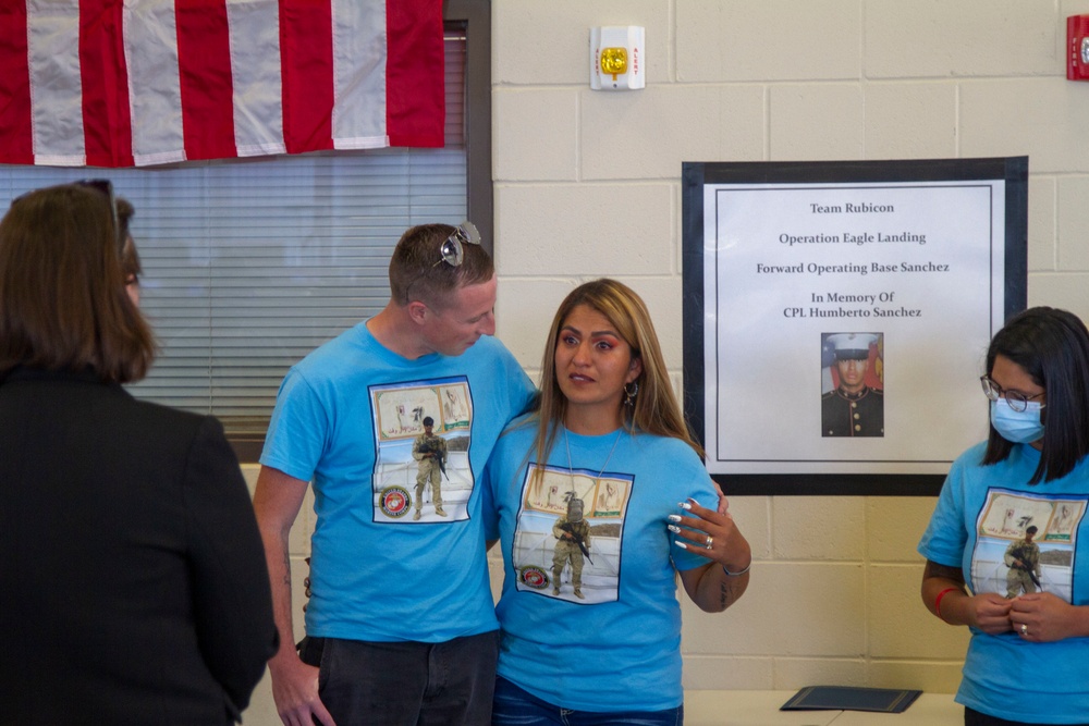 Personnel stationed at Camp Atterbury welcome the family of fallen service member