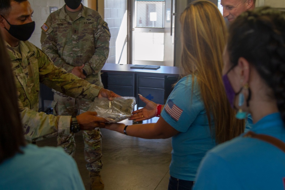 Personnel stationed at Camp Atterbury welcome the family of fallen service member