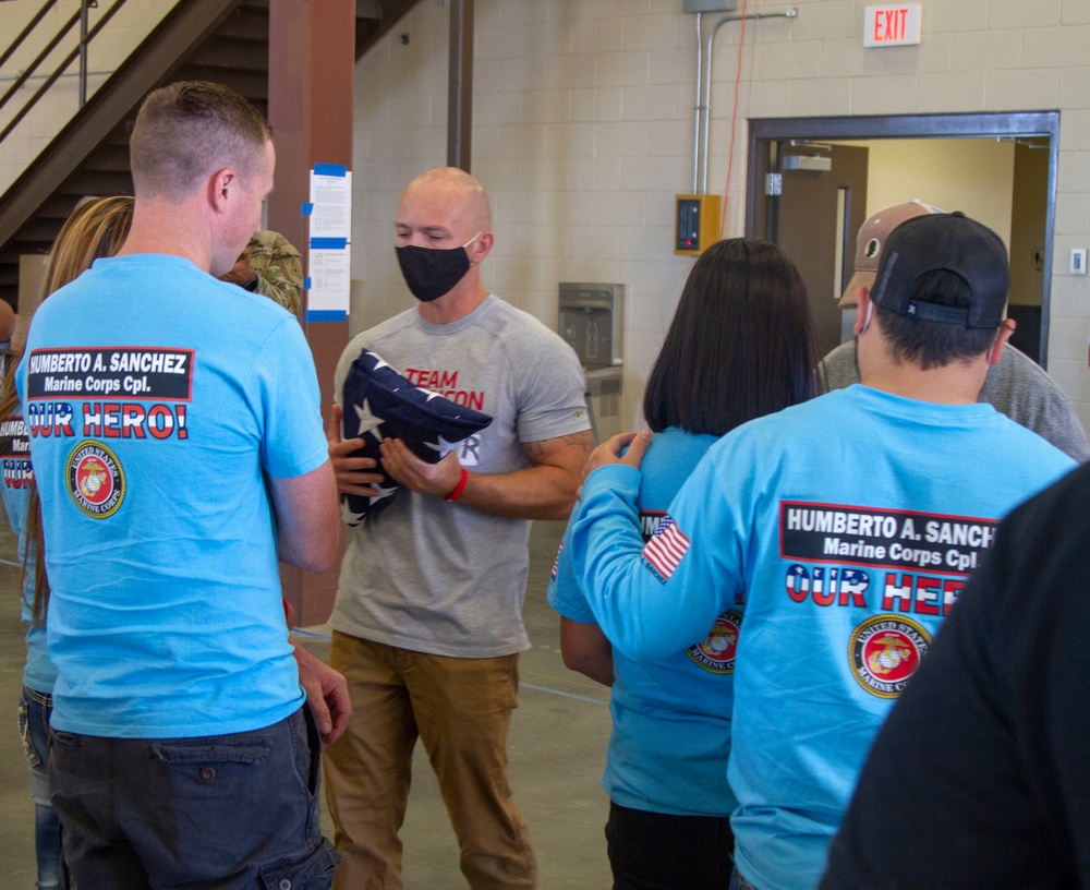 Personnel stationed at Camp Atterbury welcome the family of fallen service member