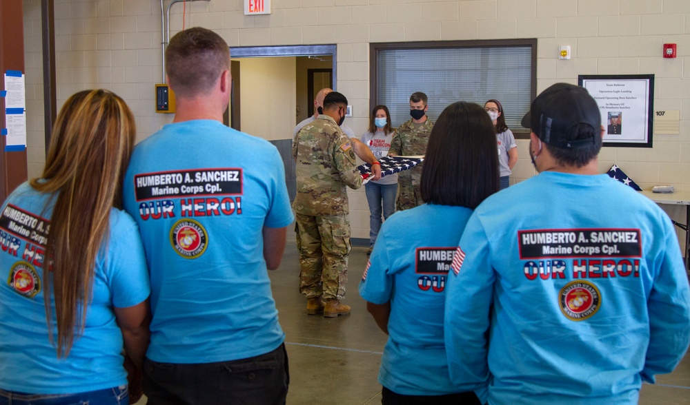 Personnel stationed at Camp Atterbury welcome the family of fallen service member