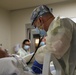 U.S. Army Medical Response Team Members Provide Care to a COVID-Positive Patient 