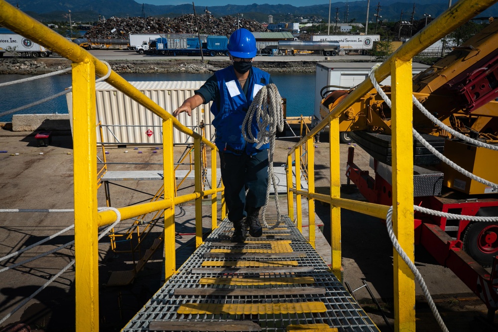 USS Sioux City Sailor Removes the Brow Security Lines During Sea and Anchor Detail
