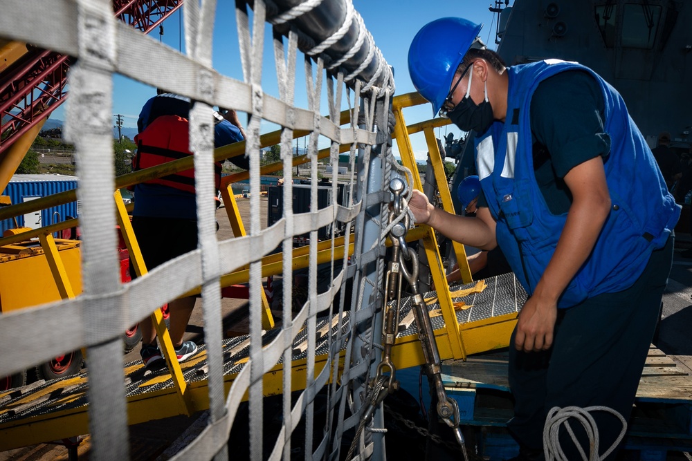 USS Sioux City Sailor Removes the Brow Security Lines During Sea and Anchor Detail