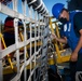 USS Sioux City Sailor Removes the Brow Security Lines During Sea and Anchor Detail