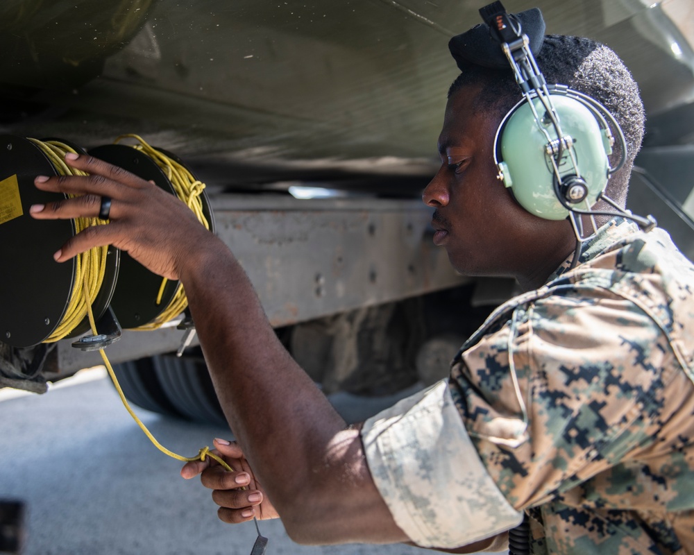Marines participate in hot pit refueling with 18th Wing Airmen