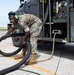 Marines participate in hot pit refueling with 18th Wing Airmen