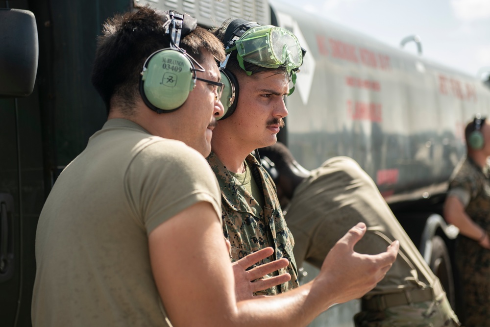 Marines participate in hot pit refueling with 18th Wing Airmen