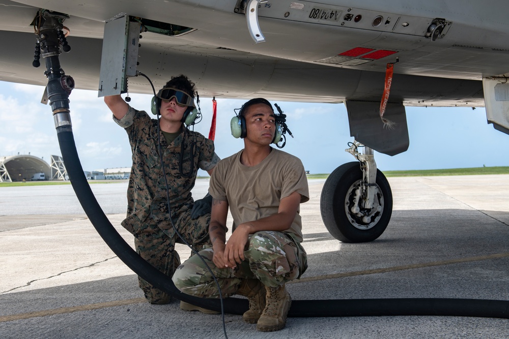 Marines participate in hot pit refueling with 18th Wing Airmen