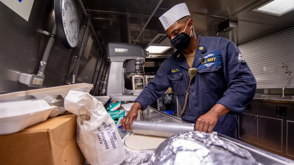 USS Charleston (LCS 18) Sailor Prepares Meal