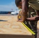 Task Force Holloman builds flooring for prayer tents