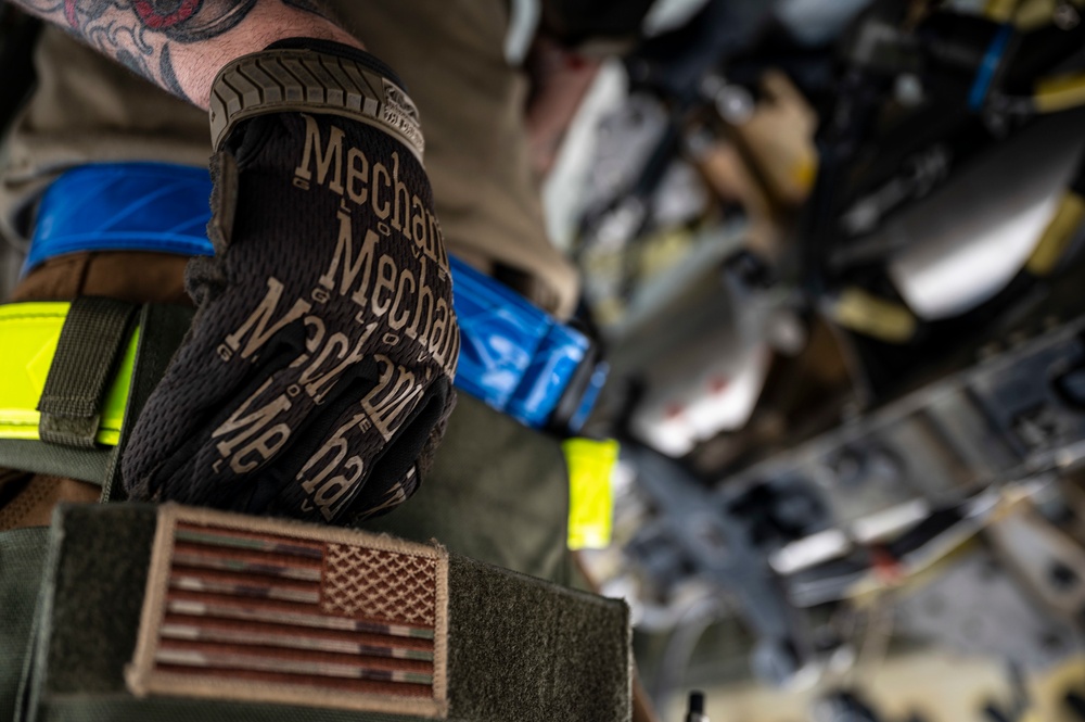 Air Force Weapons Load Crew Members Load Munitions