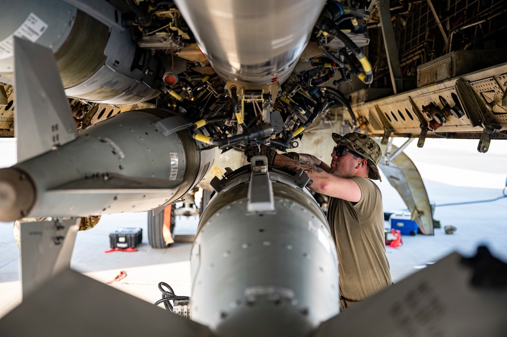 Air Force Weapons Load Crew Members Load Munitions