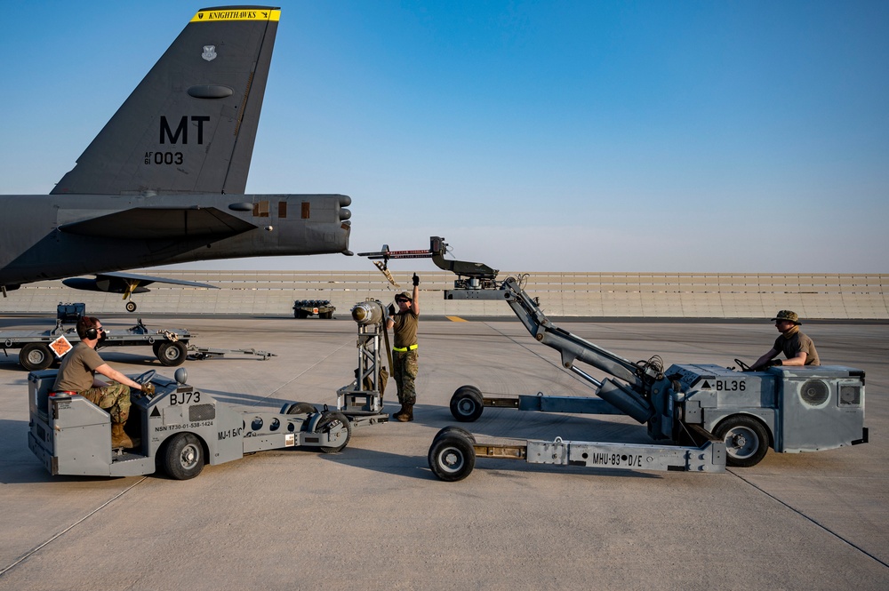 Air Force Weapons Load Crew Members Load Munitions