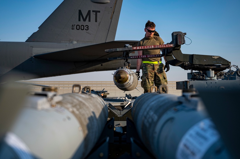 Air Force Weapons Load Crew Members Load Munitions