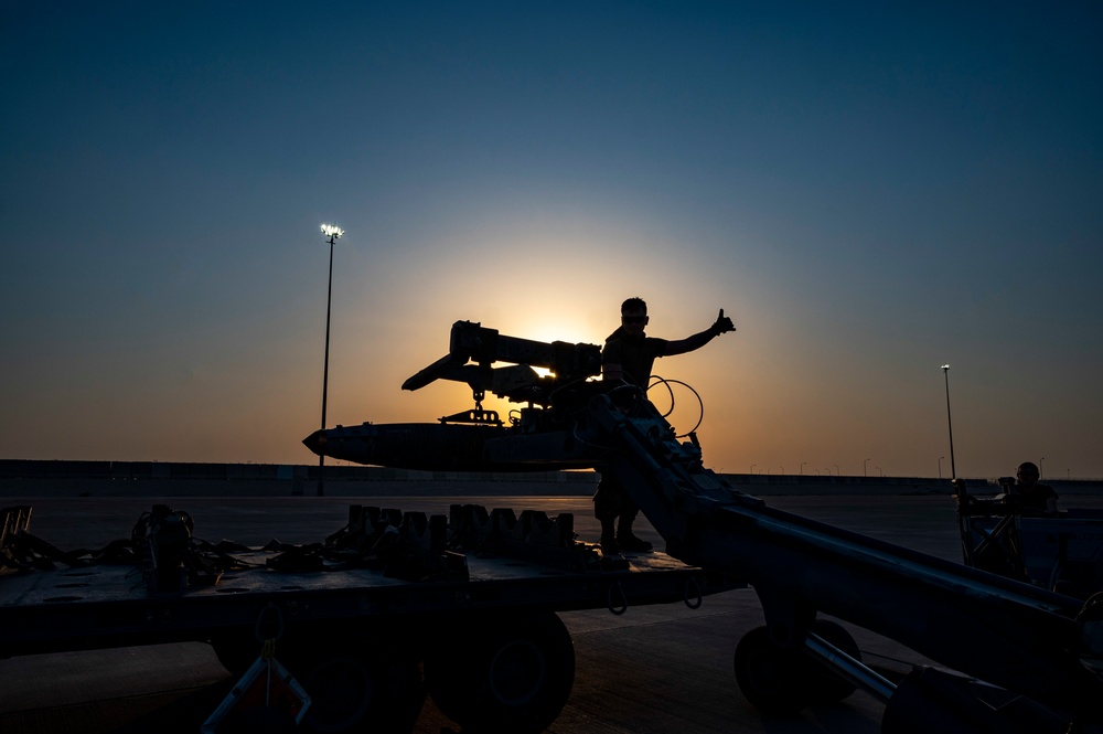 Air Force Weapons Load Crew Members Load Munitions