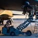 Air Force Weapons Load Crew Members Load Munitions